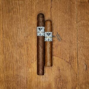 BLK WKS Rorschach Sumatra Short Robusto and Toro vitolas side by side on rustic wood surface showing Sumatran wrapper and signature white BLK WKS band