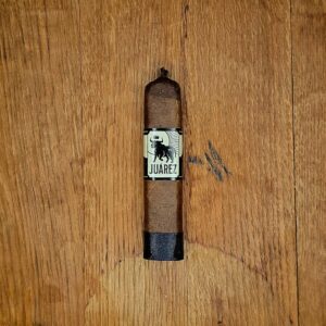 Juarez Mini Dozer LE 2026 cigar by Crowned Heads with San Andres wrapper on wood background