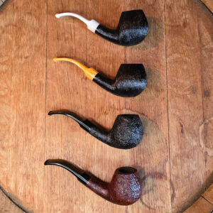 BriarWorks Classic Series Bent Apple pipes laid out in four finishes