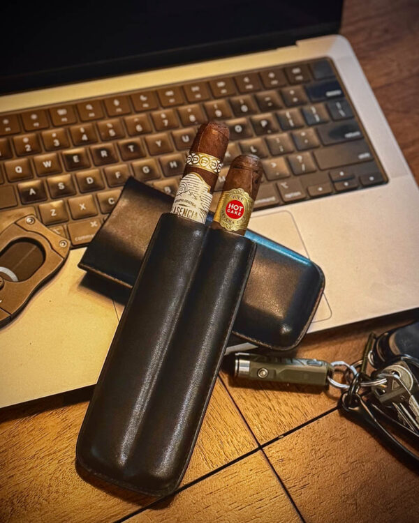 Computer with keys and cutter. Visol leather cigar holder with two cigars