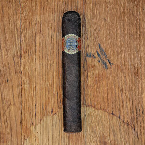 Warped Corro Maduro cigar on its own