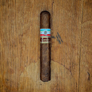 Tatuaje PCA Exclusive 2025 Corojo box-pressed Toro photographed top-down on a rustic wooden surface, showcasing the Nicaraguan Corojo wrapper and band detail.