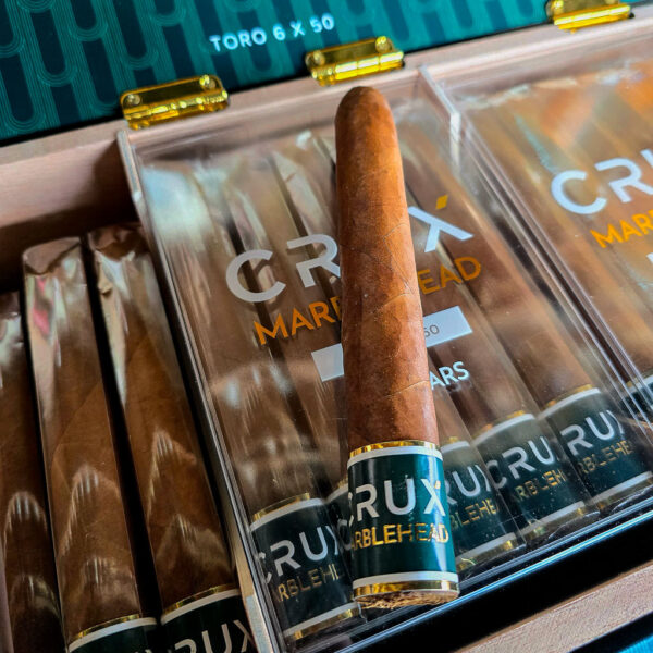 Crux Marblehead Toro cigars in open box packaging featuring 109 cap and foot band detail with Ecuadorian Colorado Habano wrapper.
