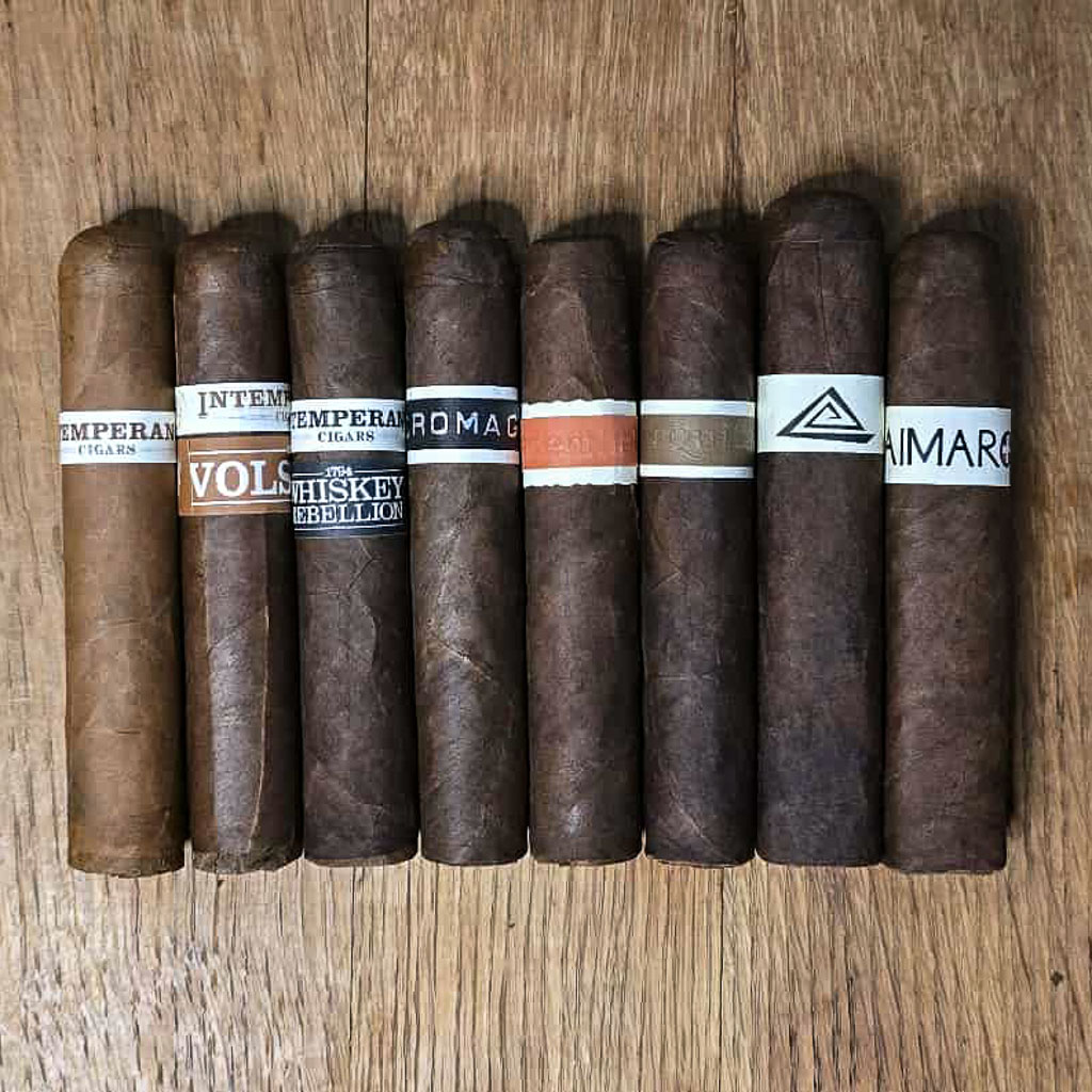 The Nica Sueño Collective cigar sampler featuring CroMagnon Patera Muilerilor, Aquitaine Patera Muilerilor, Neanderthal HoxD, Intemperance, Guaimaro Rothschild, and Fable Fourth Prime Doc