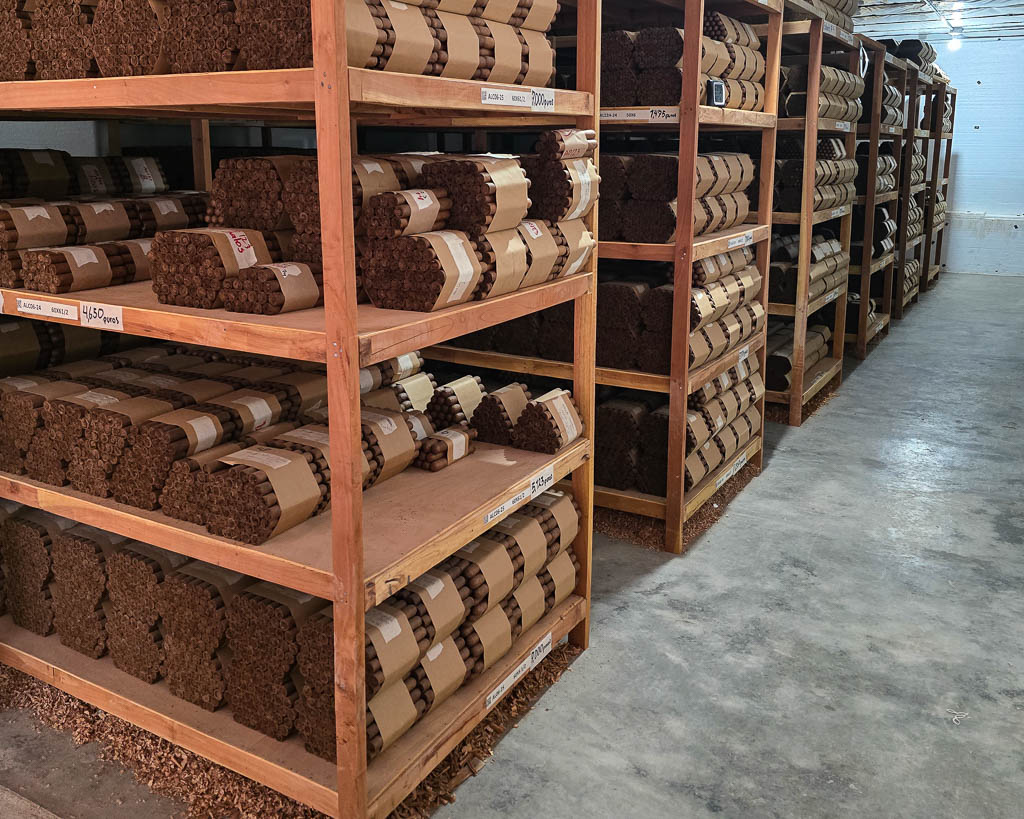 Aladino cigars aging room Honduras resting cigars on wooden shelves