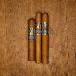 Avowed New Dawn cigars featuring Ecuadorian Connecticut wrapper on wood background
