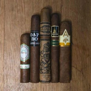 Sumatra cigar sampler with five cigars arranged on wooden barrel top