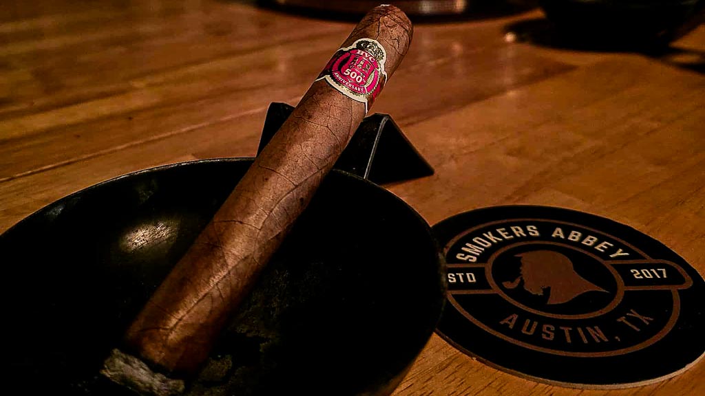 HVC 500th Anniversary cigar resting in ashtray at Smokers Abbey Austin