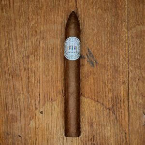 Viaje Birthday Blend 2026 torpedo cigar with white Birthday Blend band displayed on rustic wood surface showing candle-shaped torpedo format at Smokers Abbey Austin