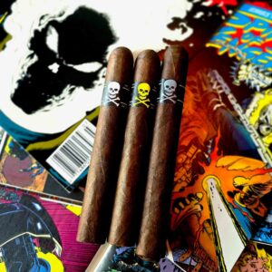 Viaje Skull and Bones Ghost Rider cigars with white, yellow, and silver skull bands held against a colorful comic book background at Smokers Abbey Austin