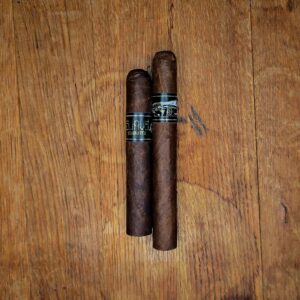 Emilio Suave Sumatra Robusto and Toro cigars with black and gold Suave band displayed side by side on rustic wood surface at Smokers Abbey Austin